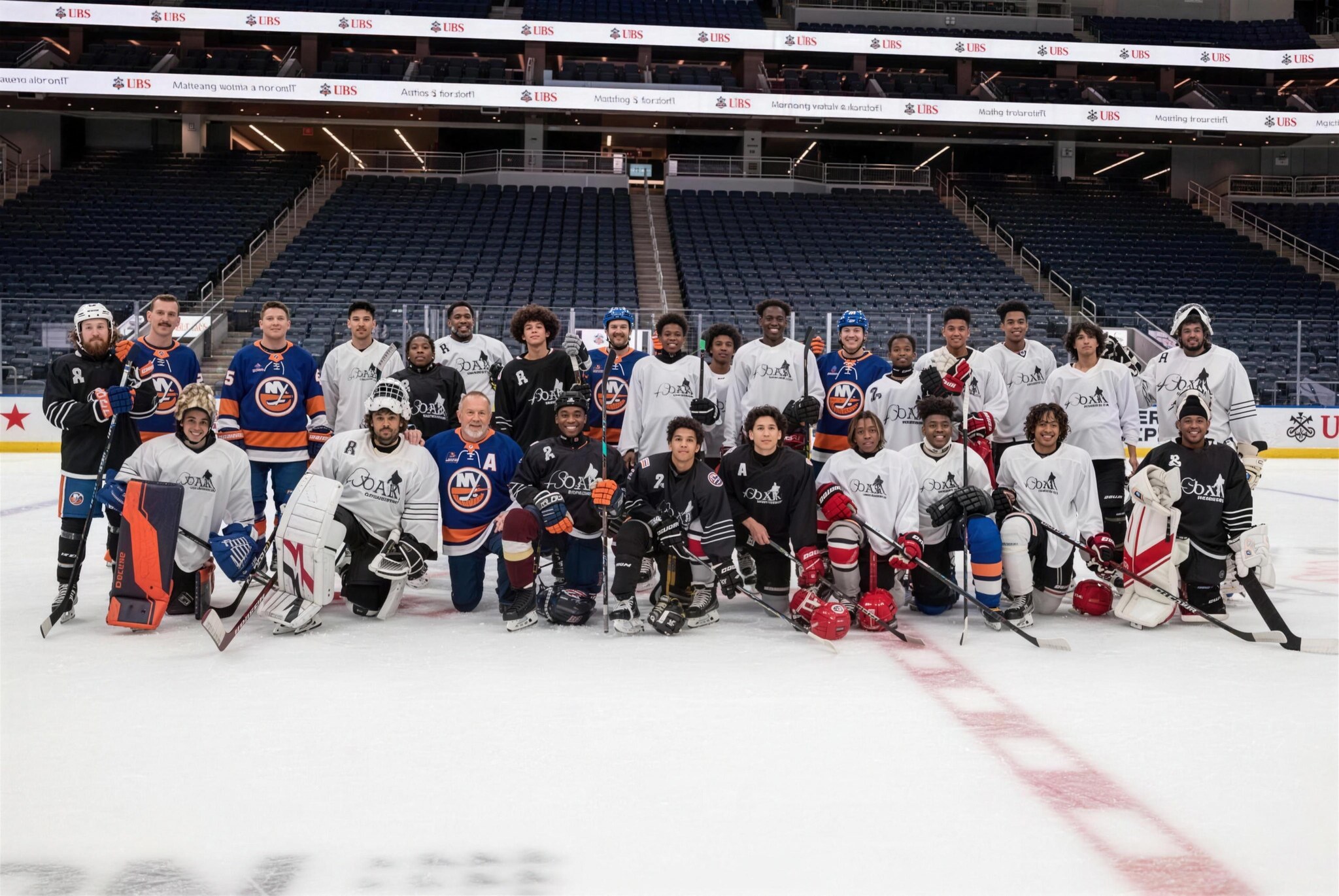 Dozens of 43 Oak Foundation athletes gathered for a group photo on the ice at UBS Arena.