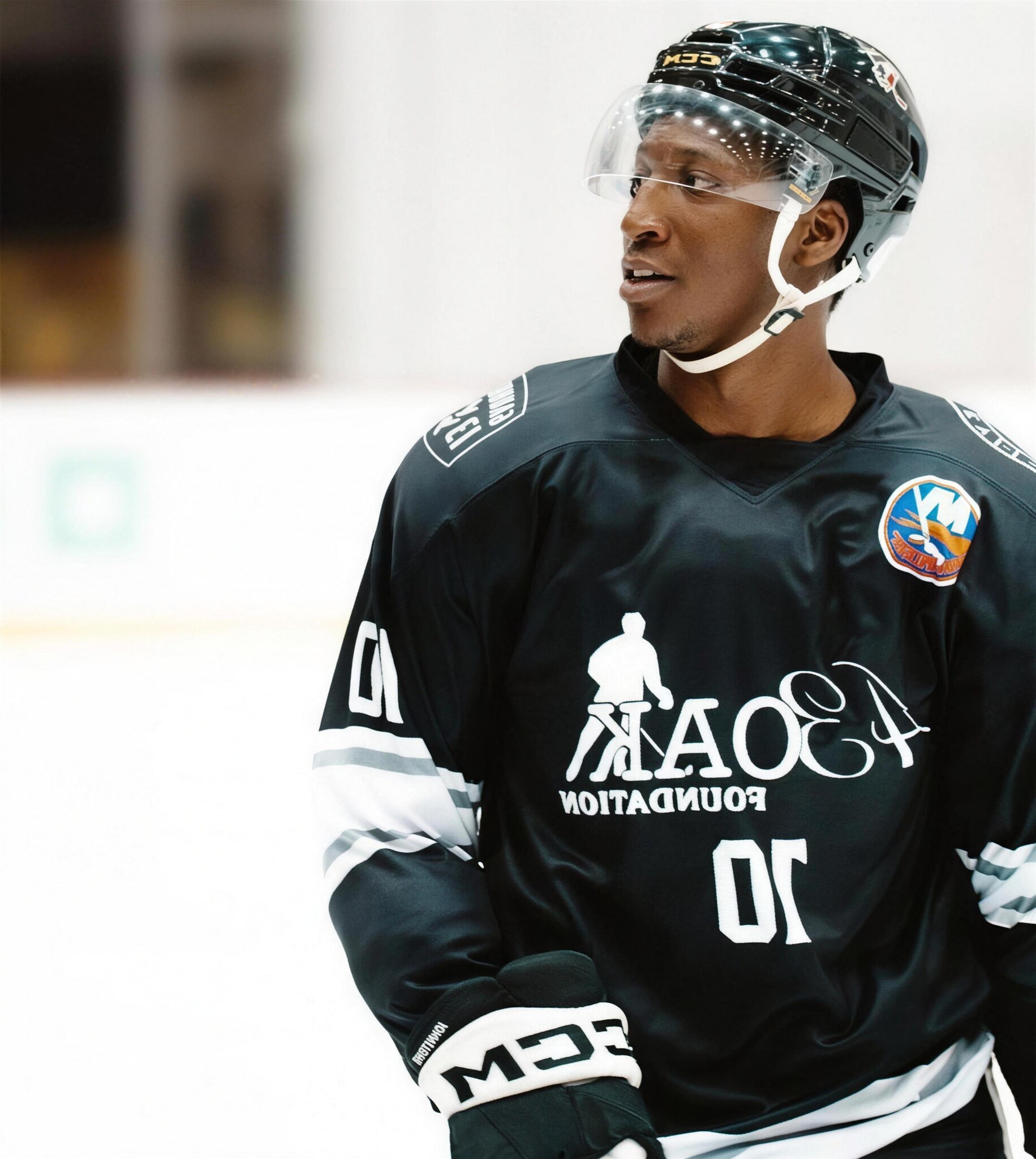 A 43 Oak Foundation athlete in a game jersey on the ice at UBS Arena.