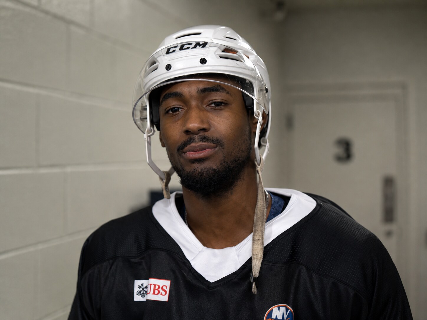 Portrait of a 43 Oak Foundation athlete in a helmet and foundation jersey.