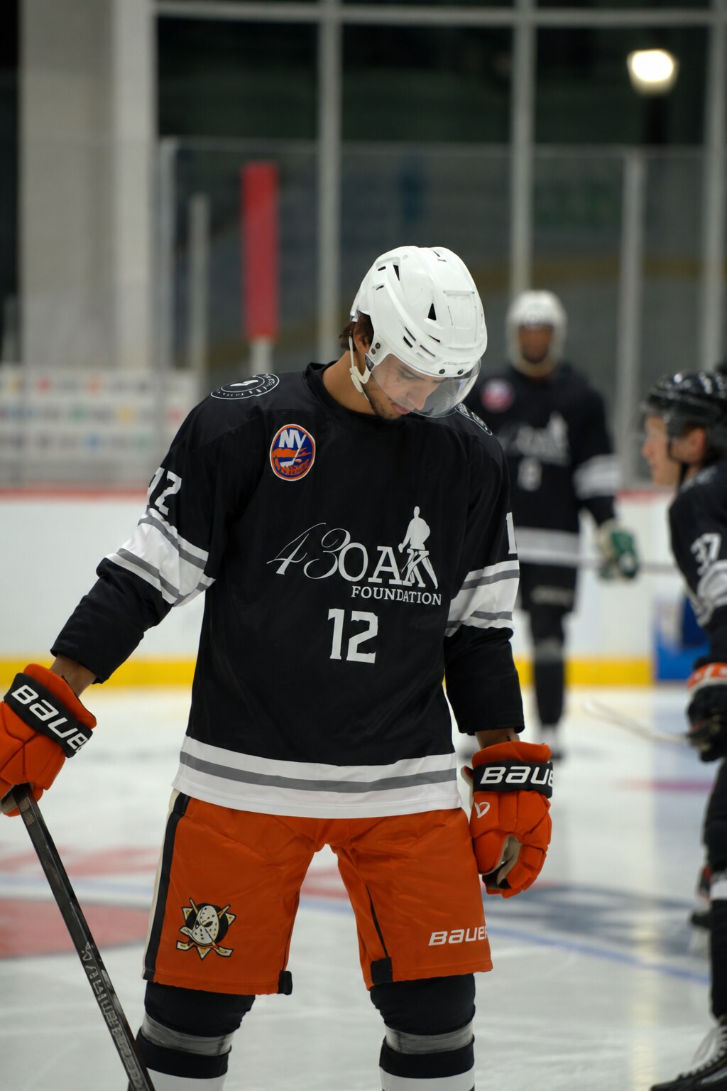 A 43 Oak athlete, number 12, on the ice.